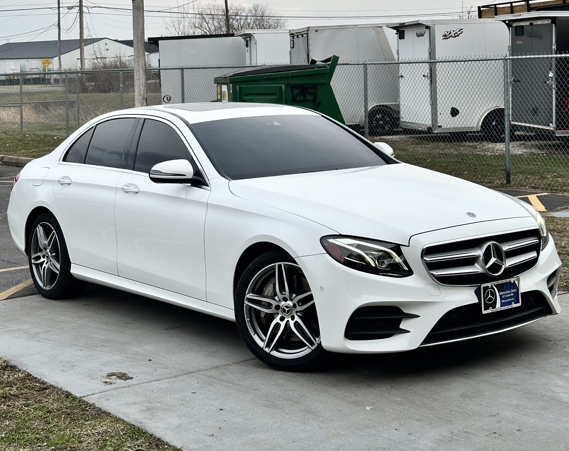 Car with dark tinted windows in a clean shop setting
