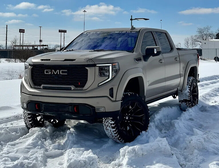 Close-up of a glossy car hood reflecting light